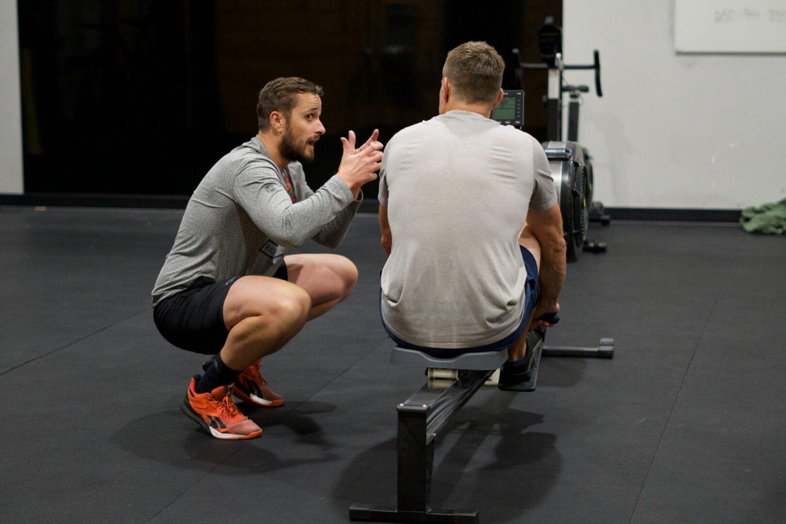 Coach with a member during a personal training session at Orleans CrossFit